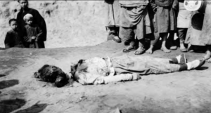 Image shows decapitation person laying on the ground
