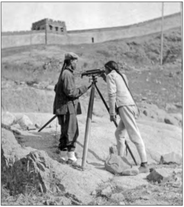 Images shows two Chinese surveying near the Great Wall for the new railway 