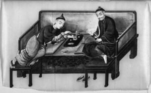 painting of two men lounging and smoking