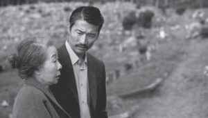 black and white photo of an old woman and a man