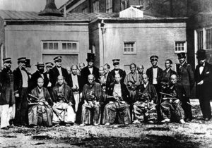 a photo of a ground of people, half are in samurai robes and the other are in military uniforms