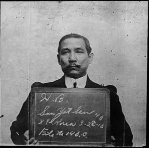 photo of a man holding a sign with his personal identification