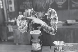 photo of a woman making coffee