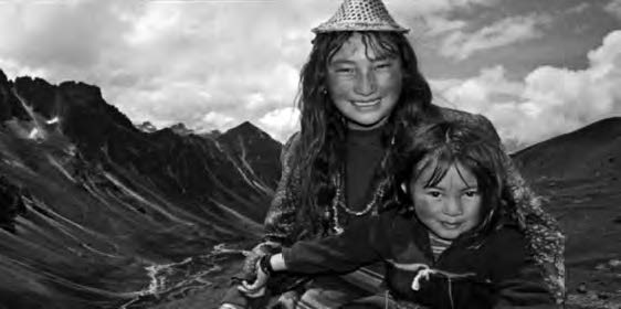 a photo of two young girls smiling