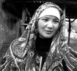 a woman in an elaborately designed head covering