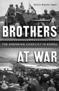 Photograph of the book cover for "Brothers at War." The cover photo shows South Korean troops holding a flag on top of a military tank. 