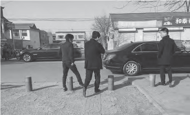 photo of men in suits walking to their car