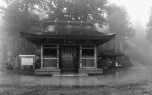 Temple gate appears in the rain.