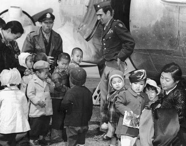 US Air Force Chaplain Lt. Col. Russell Blaisdell, left, and Lt. Col. Dean Hess, right, visit Jeju Island after saving nearly 1,000 Korean orphans in late 1950. 