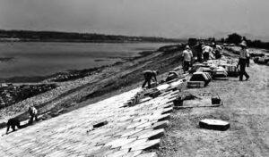 photo of people constructing a levee