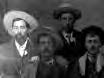 photo of several men in suits and cowboy hats