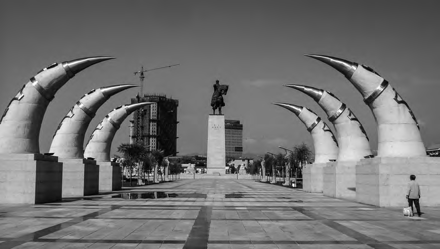 The Chinggis Khan Monument located in Hohhot, Inner Mongolia. The monument is a grand and imposing structure that pays homage to Chinggis Khan, the renowned Mongolian leader. It stands tall and proud, symbolizing the historical and cultural significance of Chinggis Khan in the region.