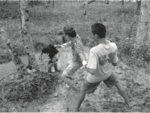 A group of students walk down a mountain together. 