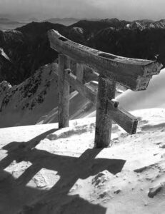 view of a torii gate in the snowy mountains