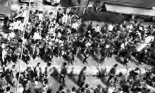 aerial view of a crowd pulling a rope