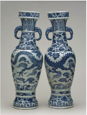 photo of two porcelain vases with white and blue designs