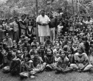 hyam Sundar Paliwal (center in white) surrounded with women and girls from the village of Piplantri. 