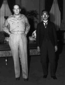 Two men, general MacArthur and Emperor Hiroshito, stand next to each other.