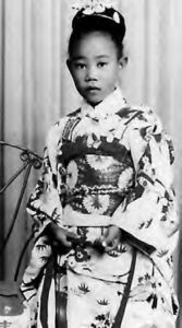 a little girl in a kimono