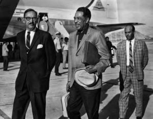 photo of several men in suits walking