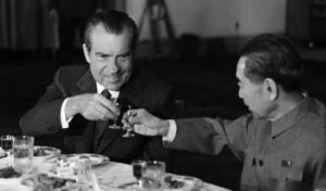 photo of two men sharing a drink