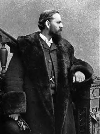 Ernest Francisco Fenollosa photograph. He is wearing a large fur coat and a Western business suit. 