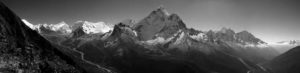 A serene landscape of mountain tops visible over fog.