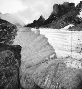 an upward view of a glacier and mountain