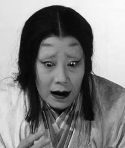 a noh actor looking horrified