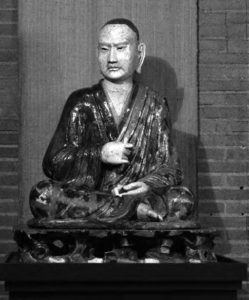 statue of a meditating man