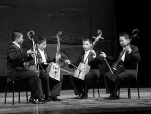 photo of several young boys playing instruments