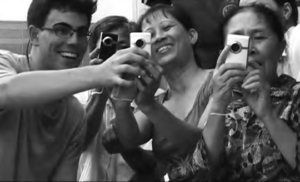 a photo of several people pointing cameras at something