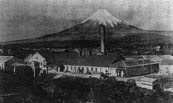 Photograph of a village in front of Mount Fuji