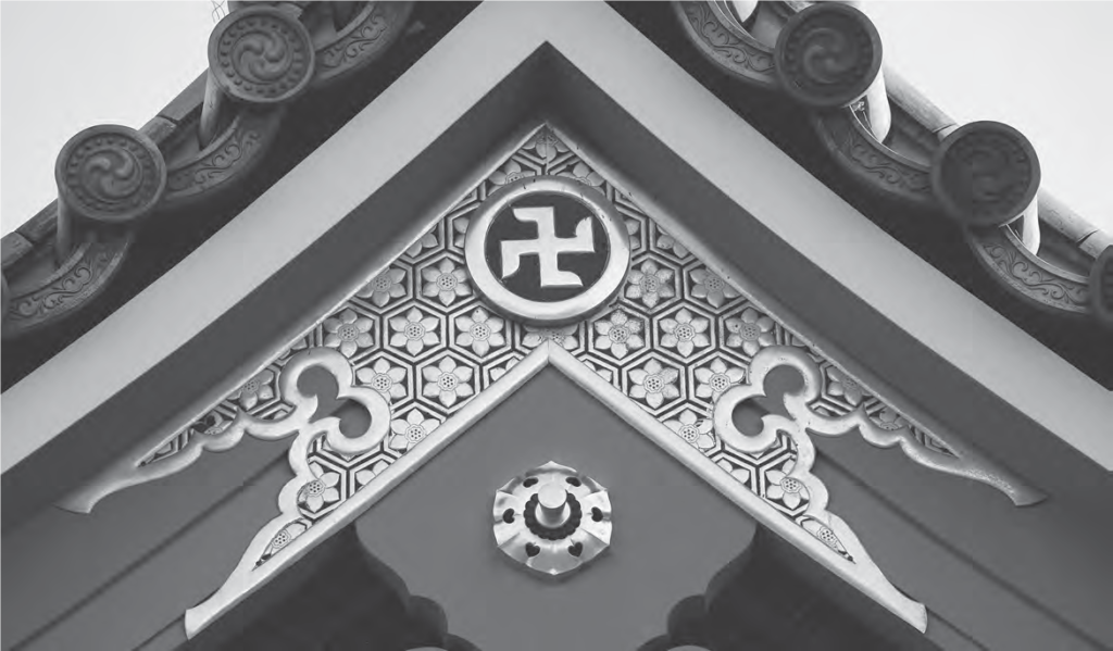 Image of Gold Buddhist swastika symbol on the Temple