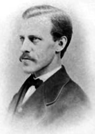 A middle aged portrait of William Griffis. He has a short mustache and is wearing a Western style business suit. 