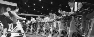 photo of people on stationary bikes
