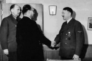 Subhas Chandra Bose shakes the hand of Hitler. 
