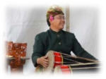 Photograph of I Made Lasmawan, Gamelan playing the drums. 