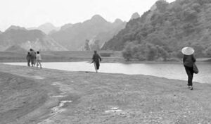 photo of a woman running with other people nearby