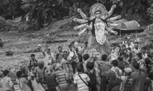 Image of crowd looking at the Hindu goddess Durga