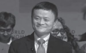 a man in a suit smiling