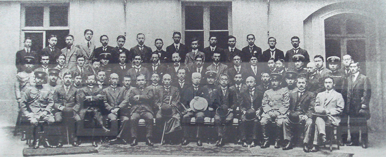 photo of a large group of men in military uniforms and suits