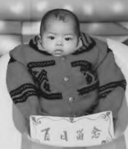 photo of a baby in a coat