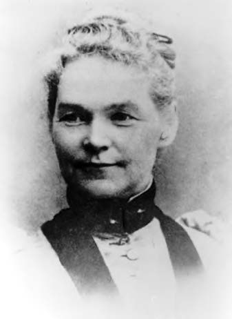 Potrait of Mary Eddy Kidder, a middle aged woman with her hair in a bun and wearing a Victorian style dress. 