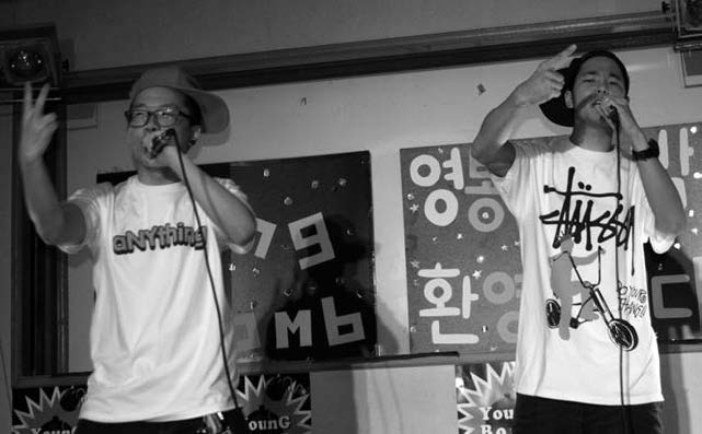 Korean rappers performing.