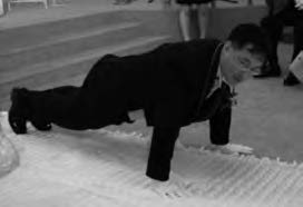 a man in a suit does pushups