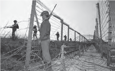 Image shows some workers standing in the line of Control