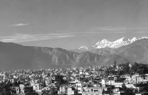 a city with mountains in the background