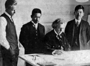 photograph of men looking down at a map