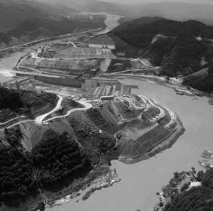 Aerial view of a river, with some construction on each side of the river